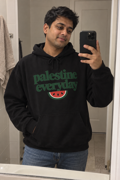 AI lifestyle image of the black Palestine Everyday Hoodie